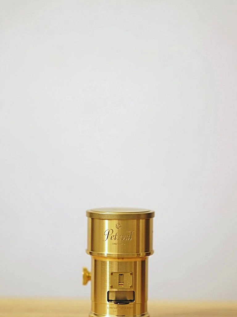 Brass ribbed pillar taper candlestick on cookbooks