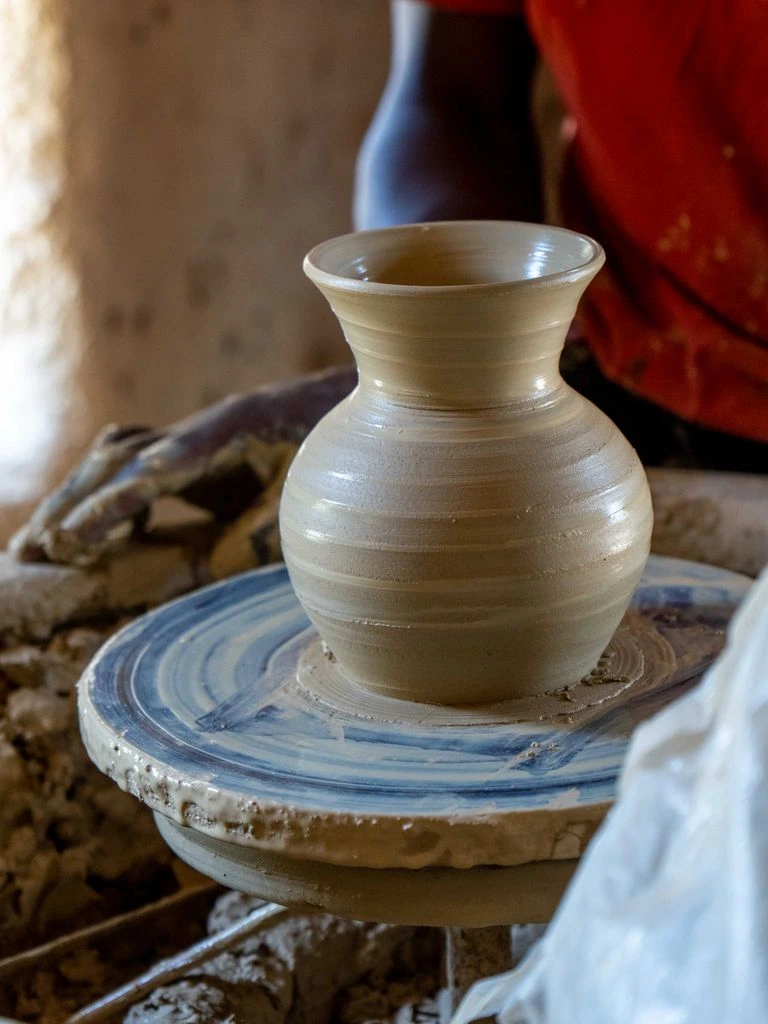 Hand-thrown oat-glaze stoneware serving bowl on oak